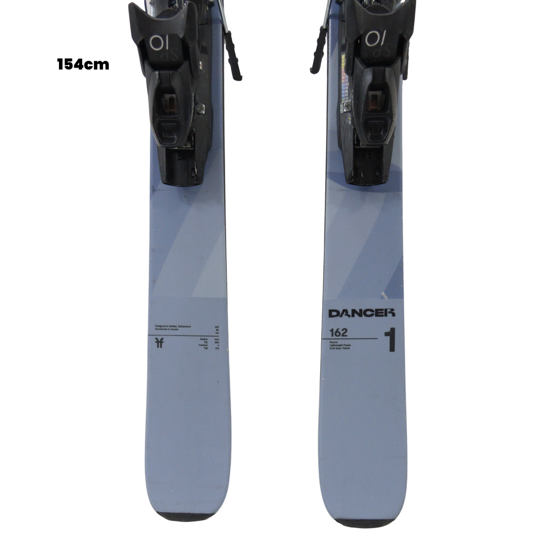 Two blue skis with black bindings on a white background, featuring the Dancer brand.