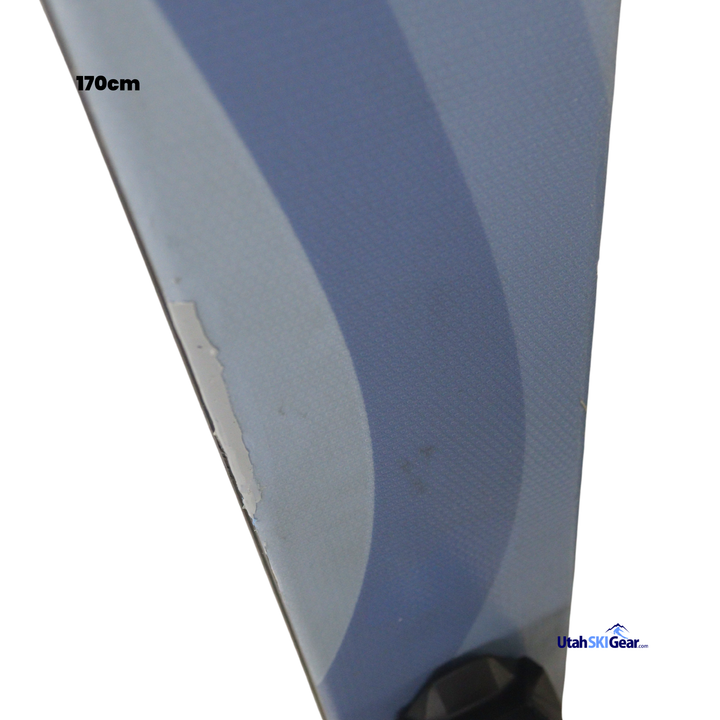 Close-up of a ski with a visible brand logo on a white background