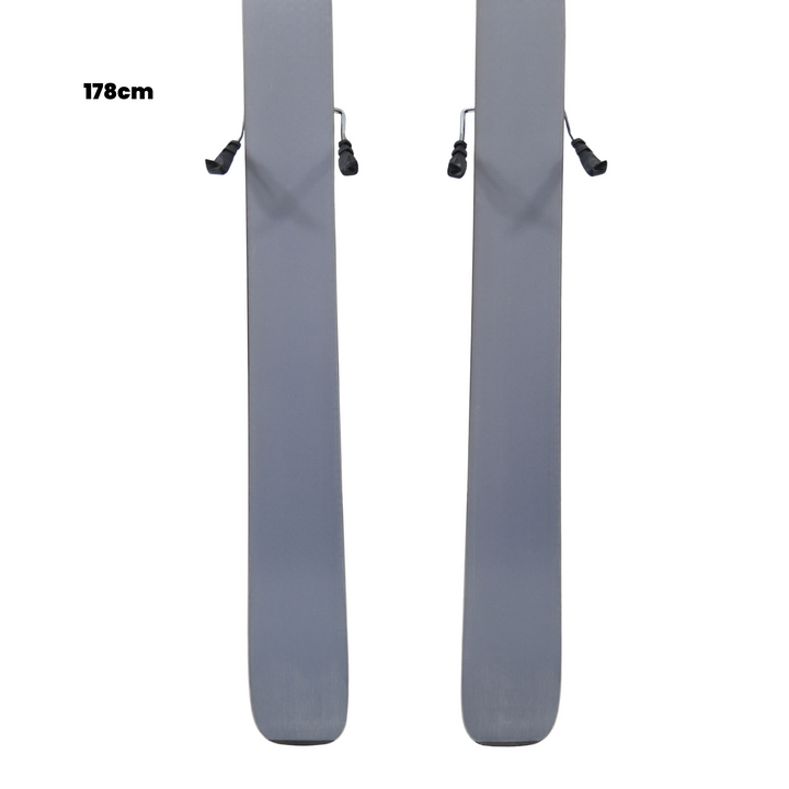 Two gray skis with bindings on a white background, featuring the Utah Ski Gear logo.