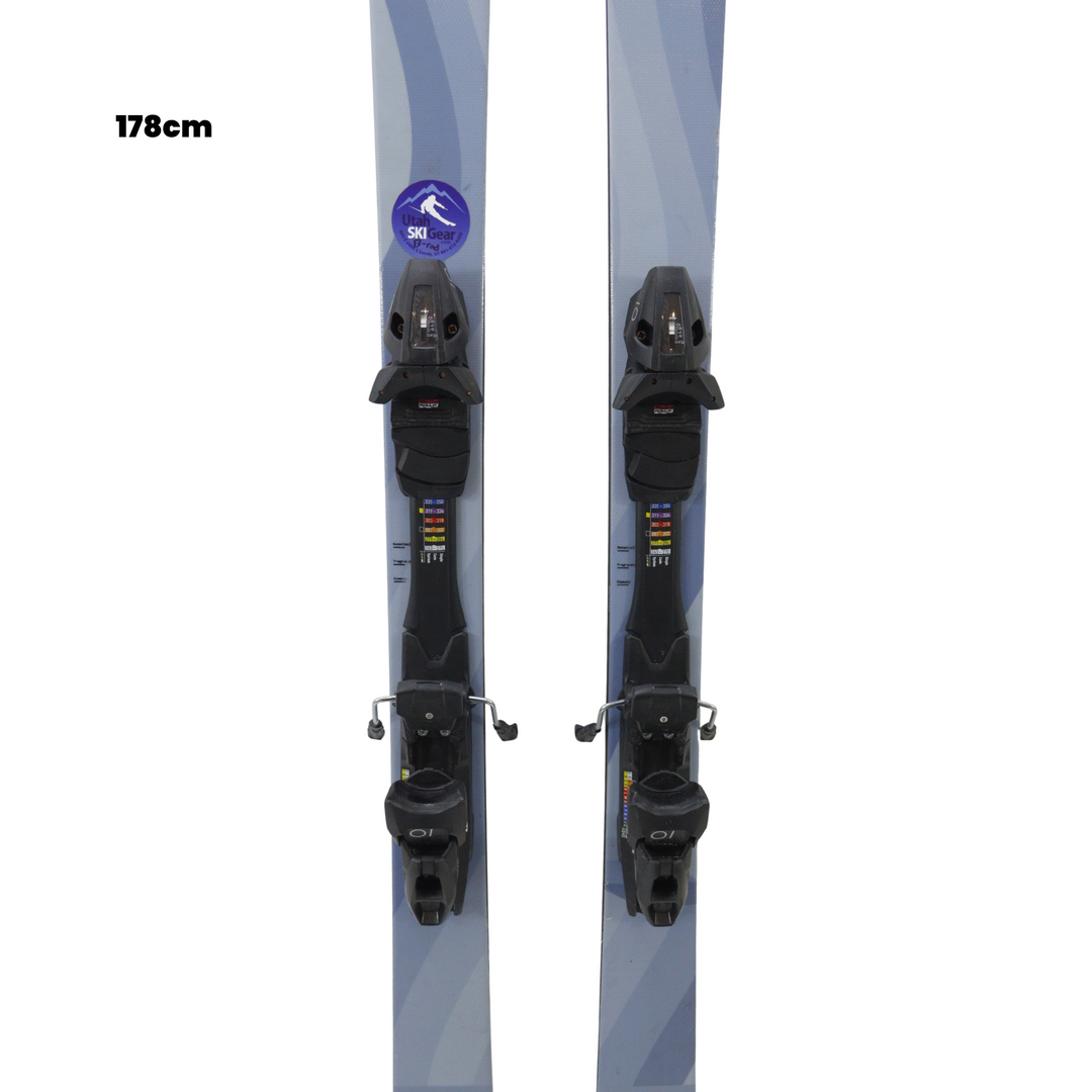 Pair of skis with bindings on a white background, featuring Utah Ski Gear logo.