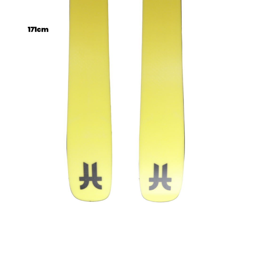 Yellow skis with black symbols on a white background, featuring Utah Ski Gear logo.