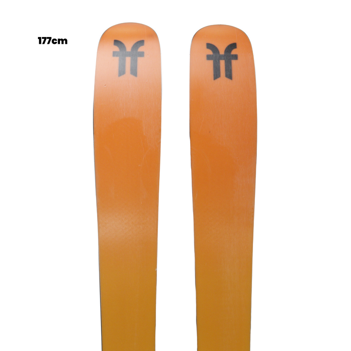Two orange skis with a logo on a white background, featuring 'Utah Ski & Gear' branding.