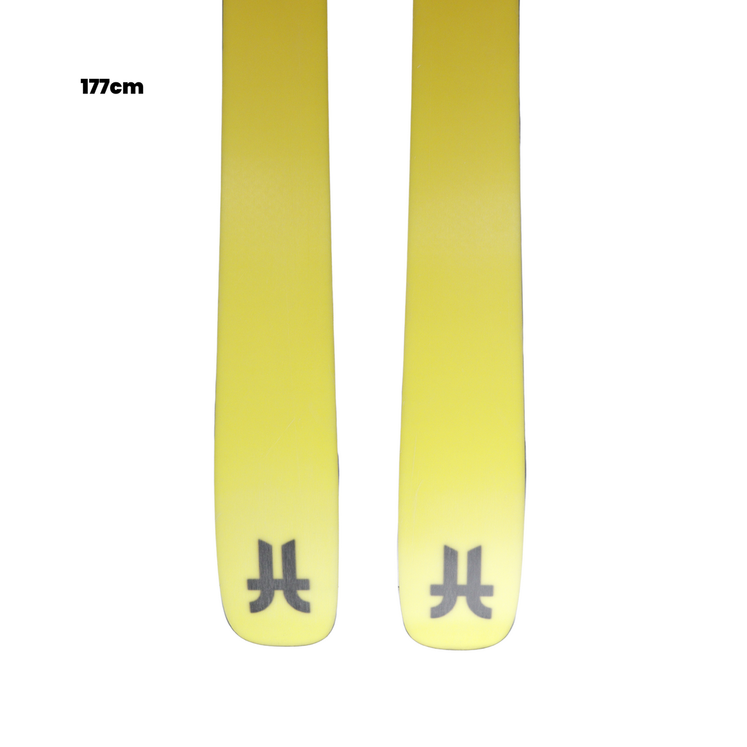 Yellow skis with a brand logo on a white background