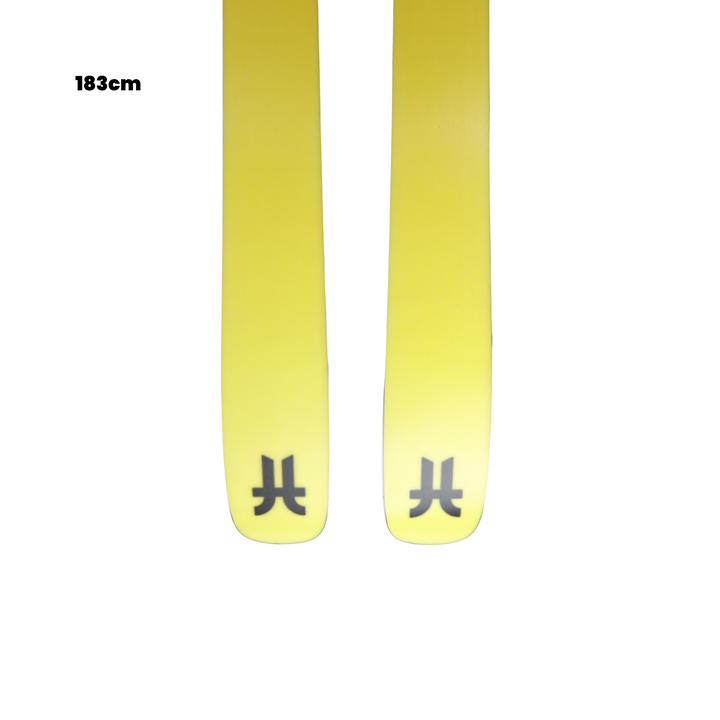 Yellow skis with branding on a white background