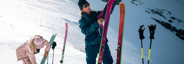 Elan Skis help by Glen Plake, professional skier. Women in background also holding an Elan Ski. 